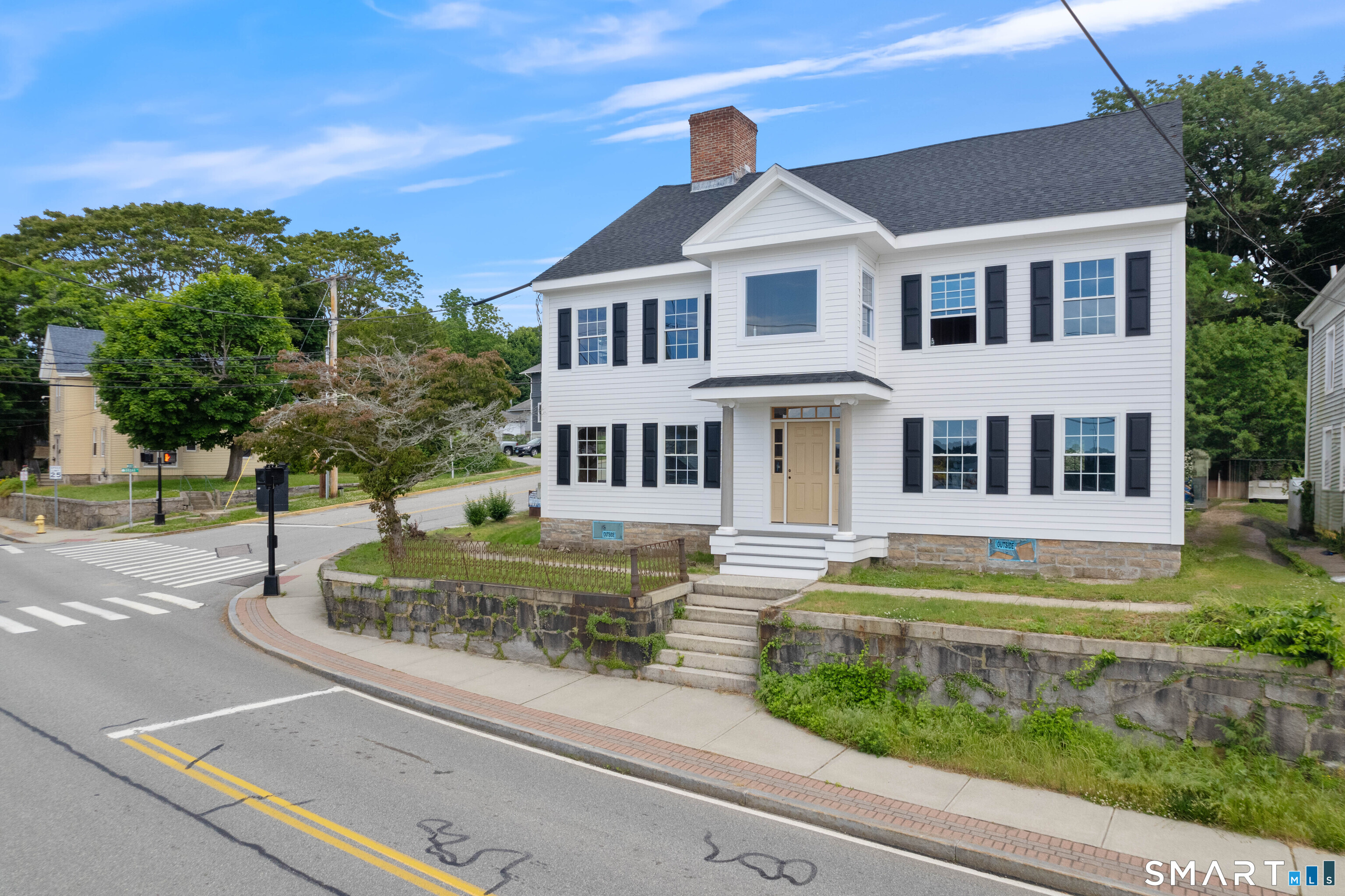 108 Thames Street Groton, CT 06340 - Photo 2 of 40 a front view of a house with a yard