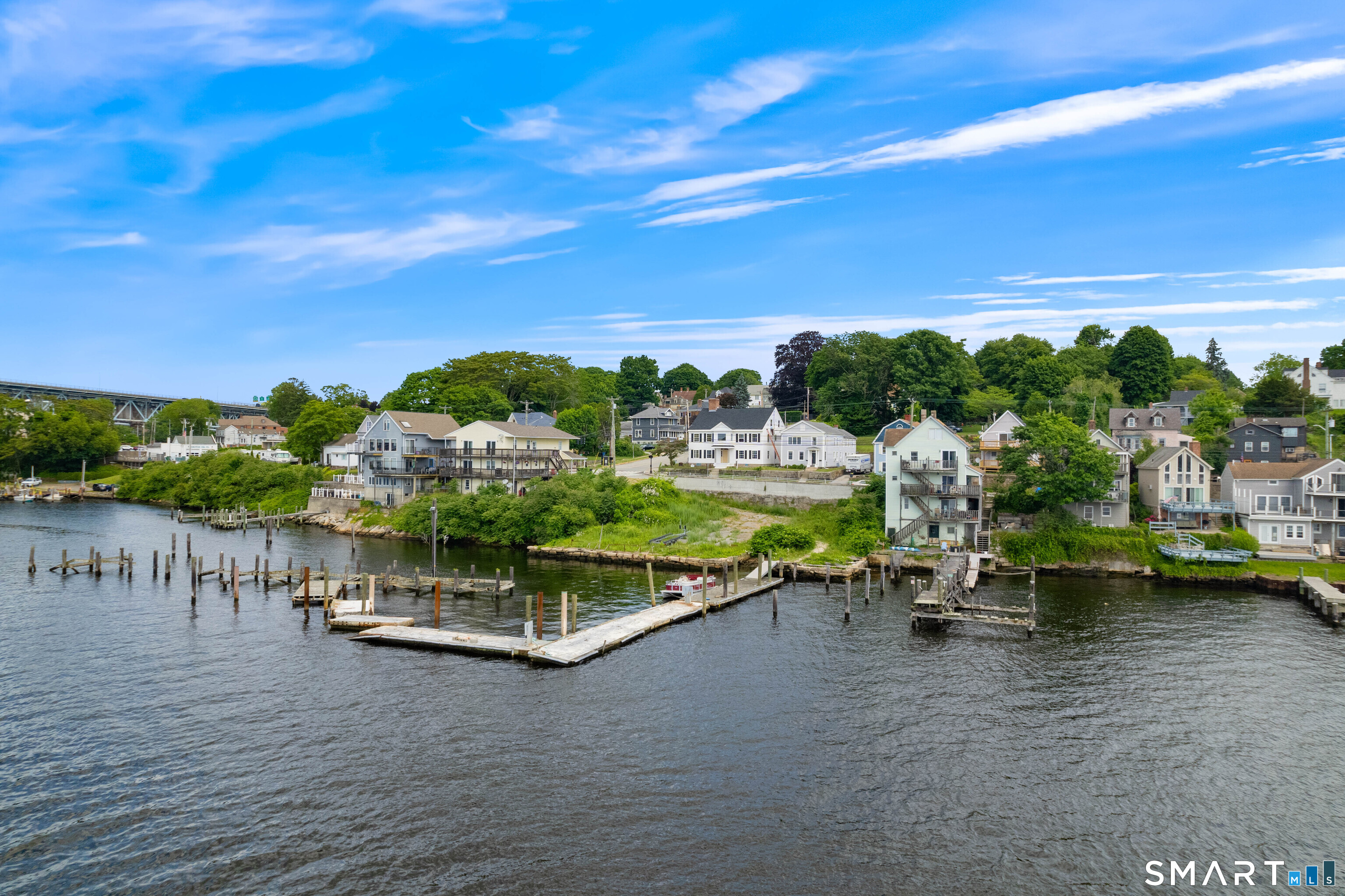 108 Thames Street Groton, CT 06340 - Photo 3 of 40 a view of a lake with a car parked