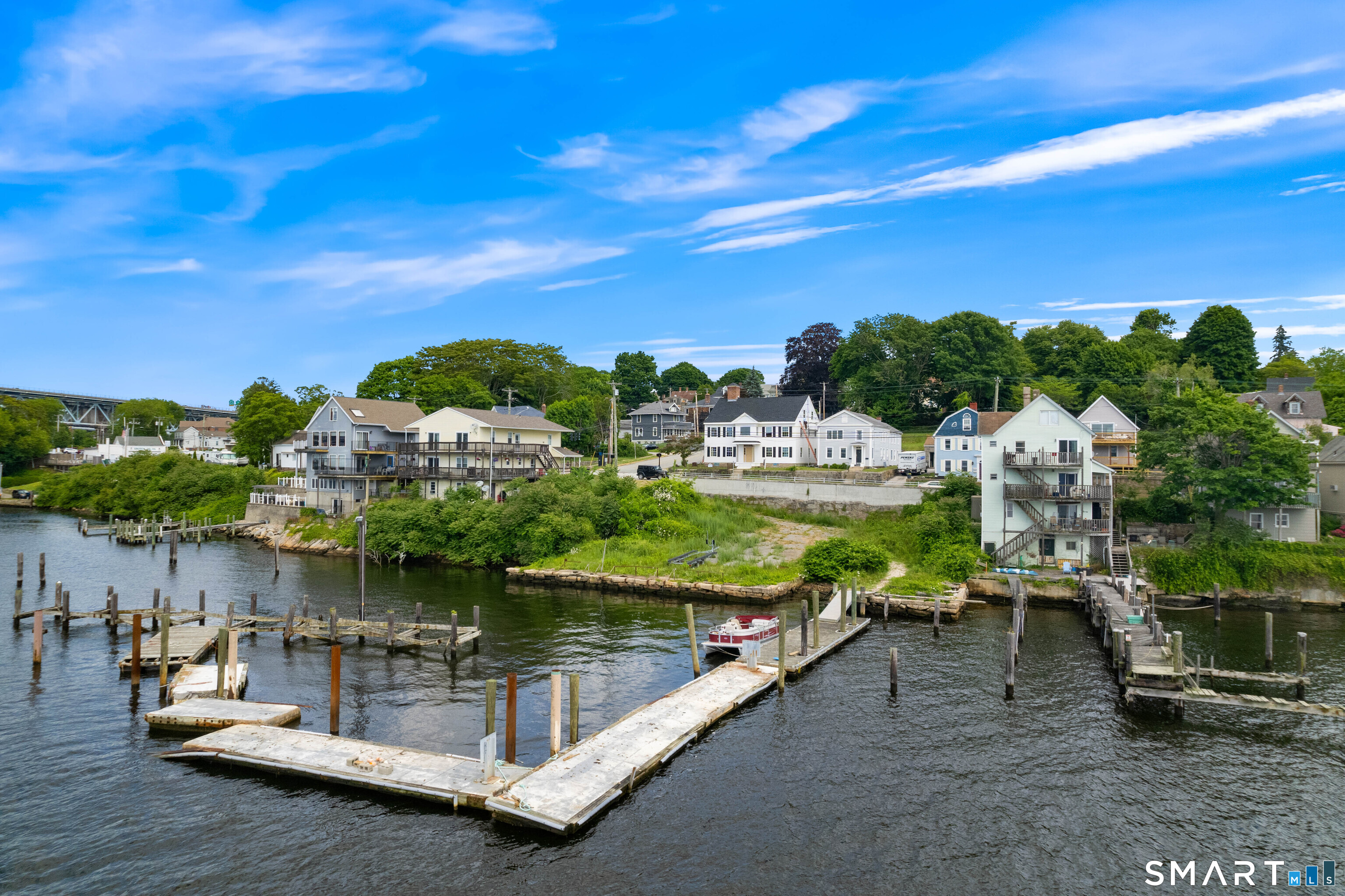 108 Thames Street Groton, CT 06340 - Photo 4 of 40 a view of a lake with a floor to ceiling window next to a yard