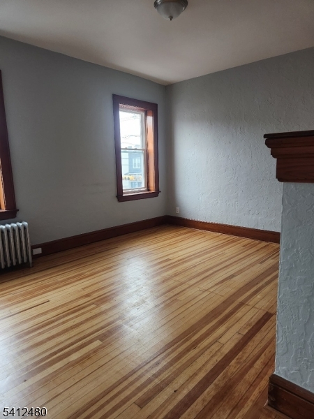 656 Summer Street, Unit 2 Elizabeth, NJ 07202 - Photo 6 of 10 wooden floor in an empty room