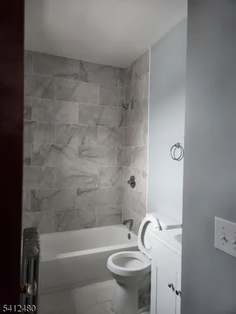 a bathroom with a sink a toilet and a bathtub