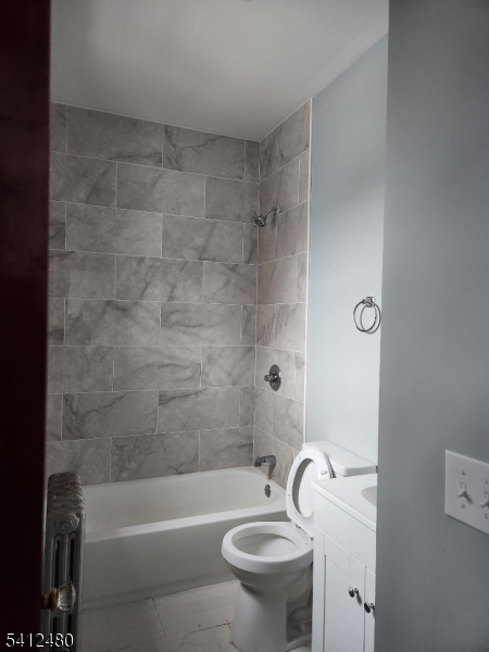 656 Summer Street, Unit 2 Elizabeth, NJ 07202 - Photo 8 of 10 a bathroom with a sink a toilet and a bathtub