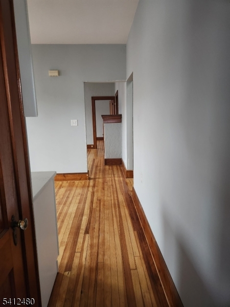656 Summer Street, Unit 2 Elizabeth, NJ 07202 - Photo 9 of 10 wooden floor in a room next to a window