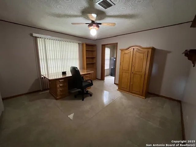 a view of a kitchen with a sink and refrigerator cabinet cabinet