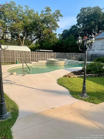 a front view of a house with a yard and a garage