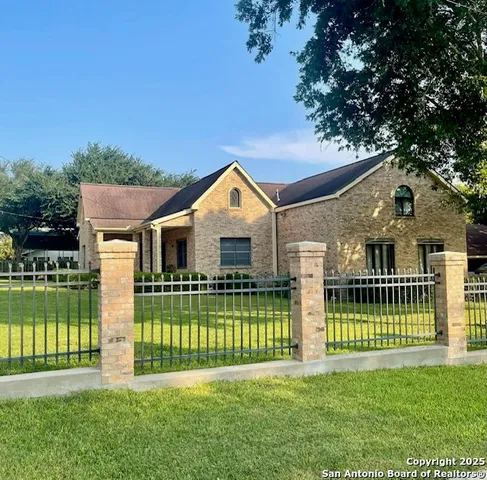 a front view of a house with a garden and deck