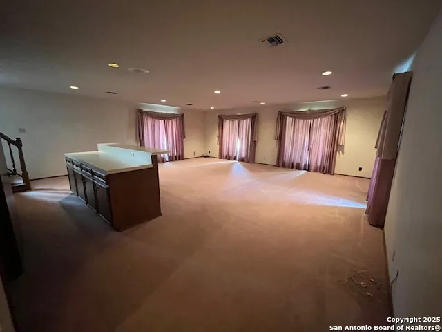 a kitchen with a refrigerator and a sink