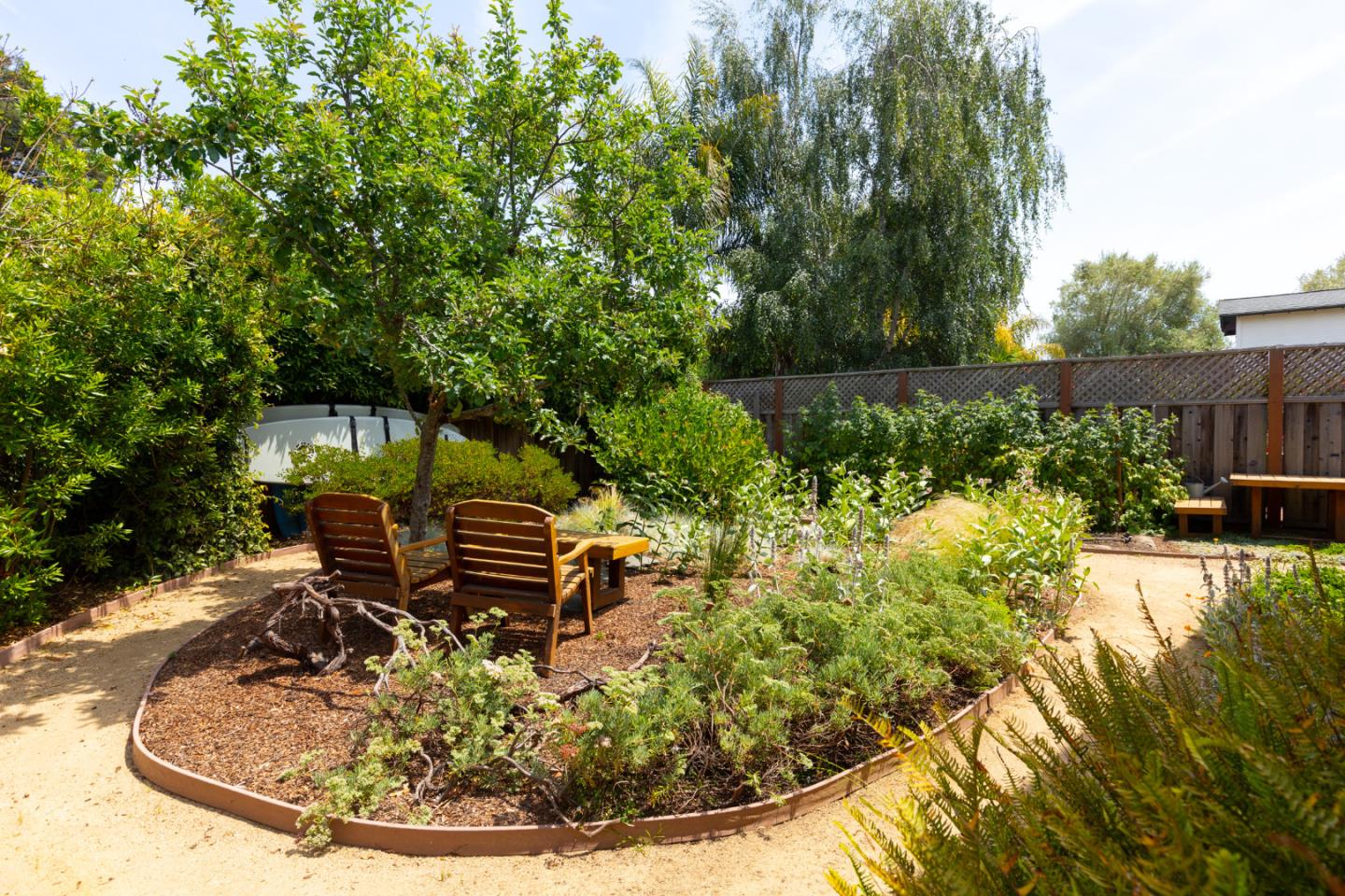 508 Oak Drive Capitola, CA 95010 - Photo 20 of 31 a view of a house with a yard patio and fire pit