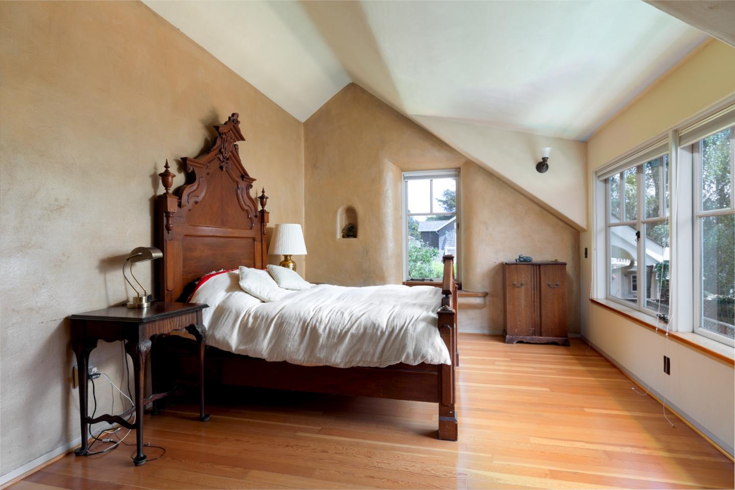 508 Oak Drive Capitola, CA 95010 - Photo 24 of 31 a bed sitting in a bedroom next to a window