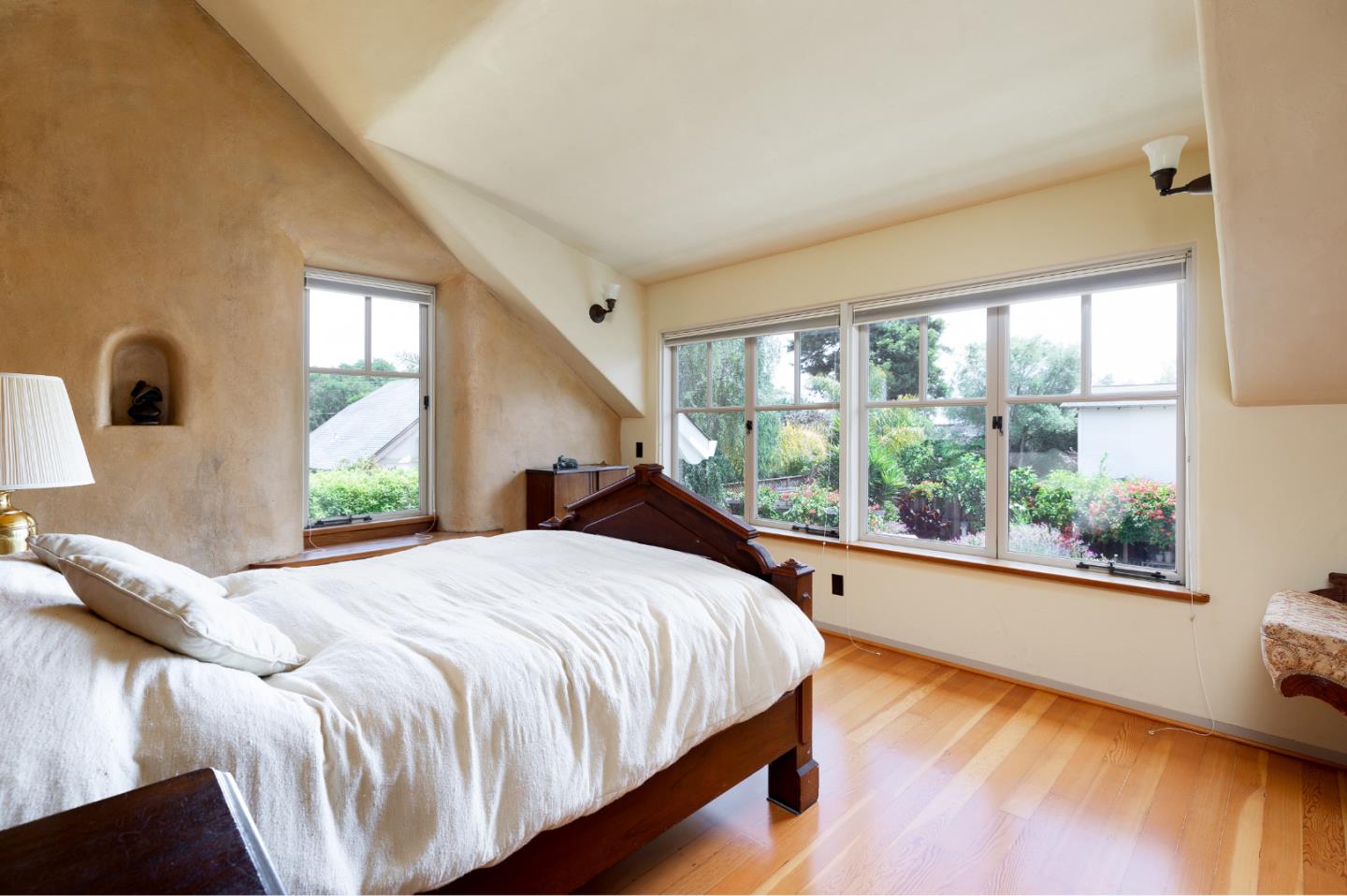 508 Oak Drive Capitola, CA 95010 - Photo 25 of 31 a bedroom with a large bed and a large window