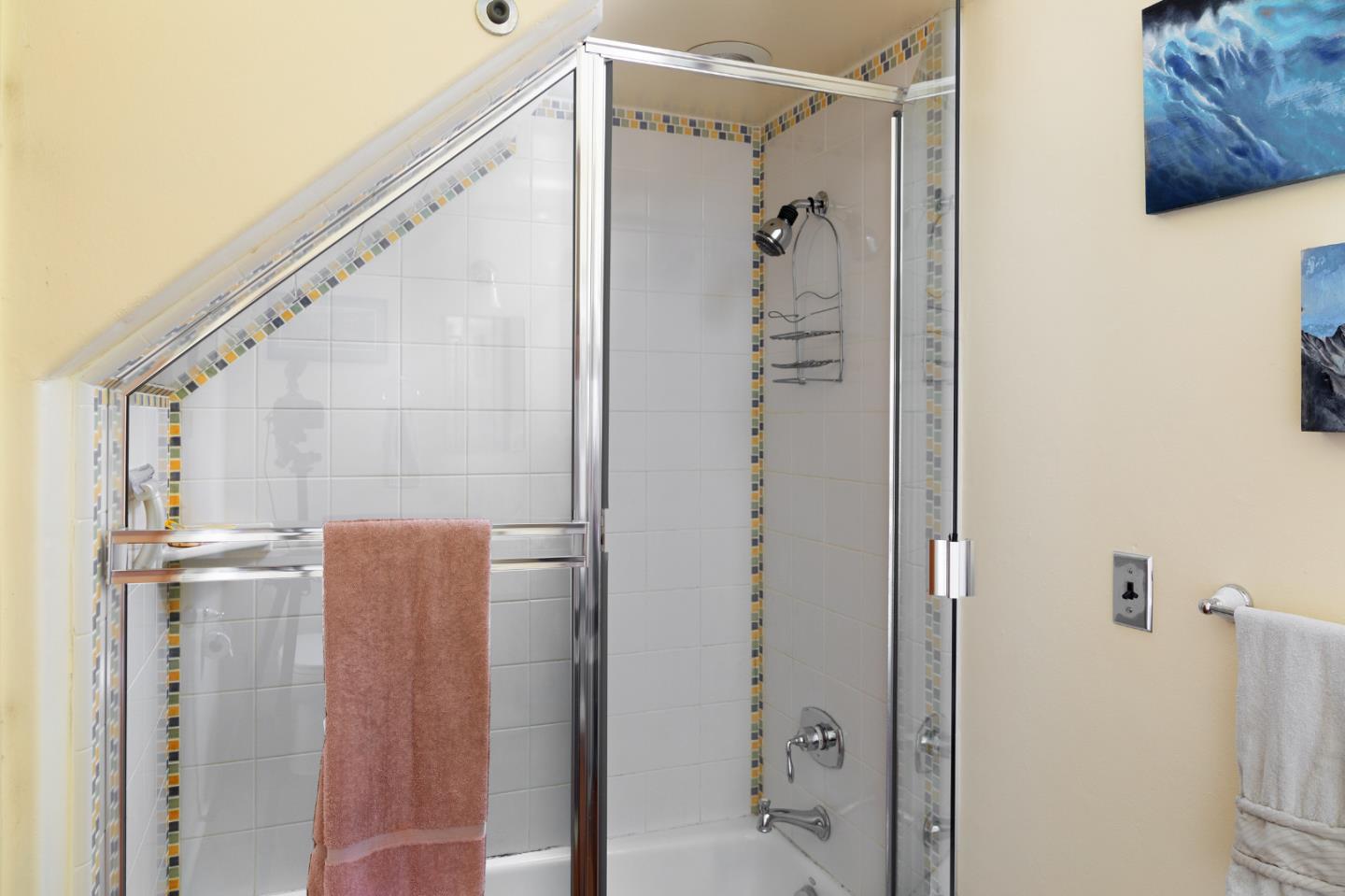 508 Oak Drive Capitola, CA 95010 - Photo 29 of 31 a bathroom with a shower and a glass door