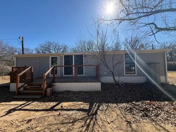a side view of a house with a yard