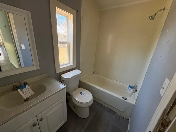 a bathroom with a sink a toilet and a bathtub