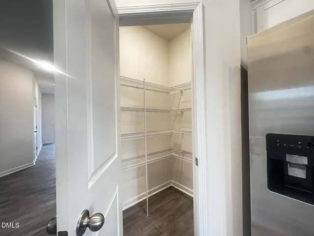 a kitchen with granite countertop a sink and cabinets