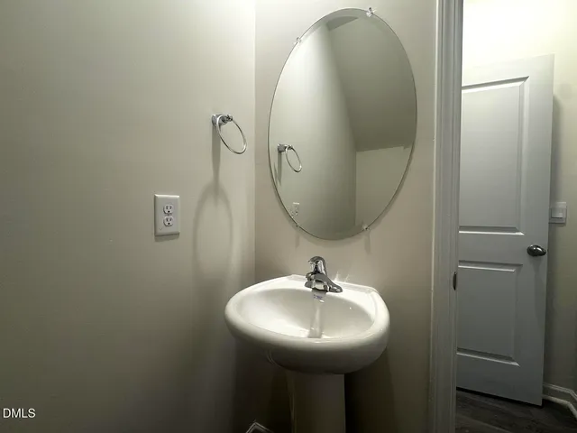 a view of a house with backyard and a tree