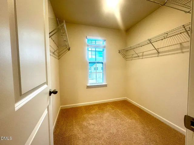 a bathroom with a double vanity sink and mirror