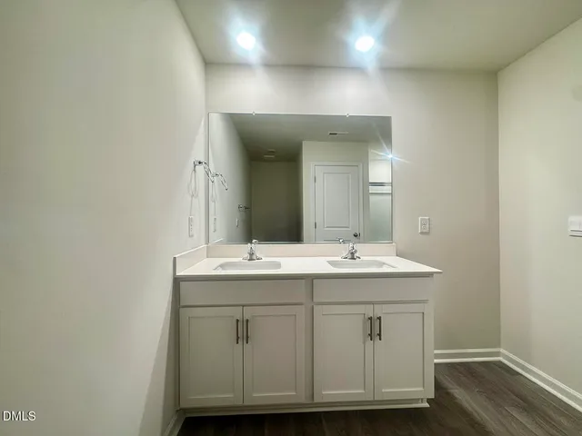 a bathroom with a glass shower door