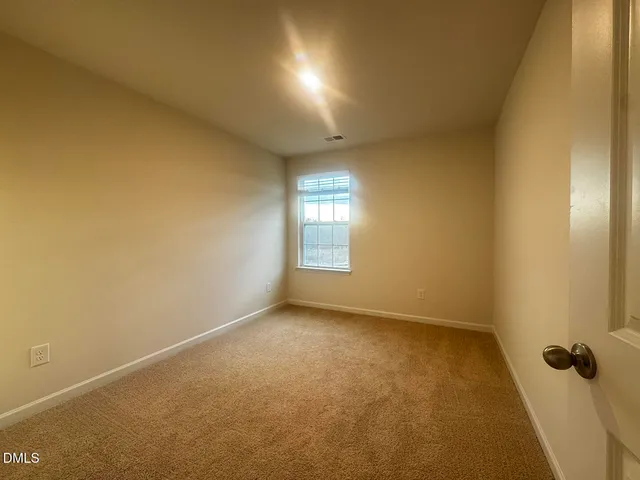 an empty room with a bathroom