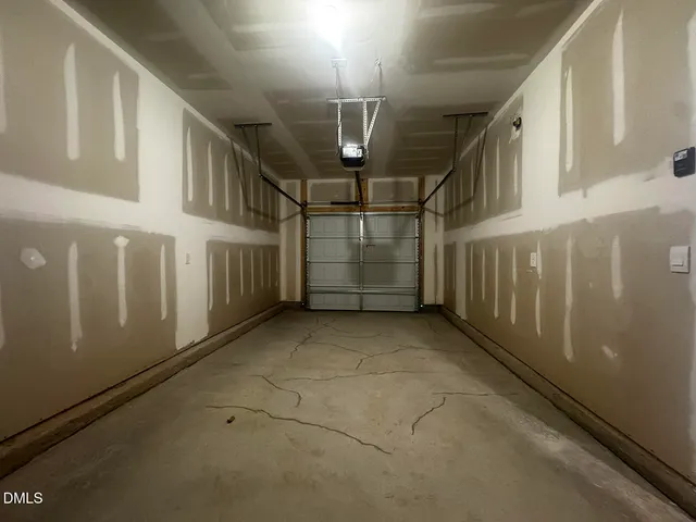 a front view of a house with a garage