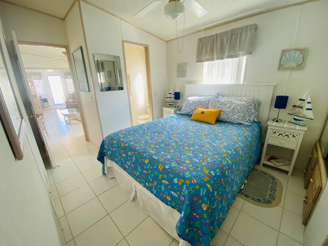 a living room with furniture fireplace and a large window