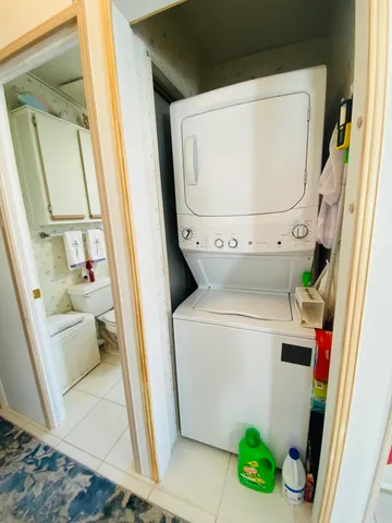 a kitchen with stainless steel appliances a stove refrigerator sink and cabinets