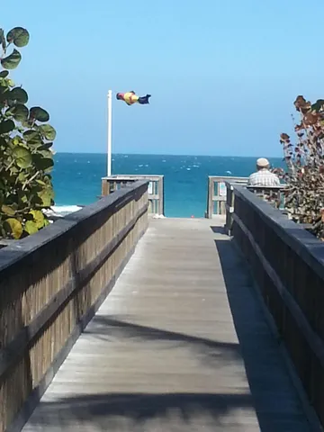 a view of a balcony with chairs and a table