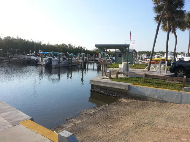 a view of a patio with chairs and a grill