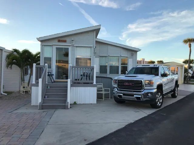 a view of a patio with a table and chairs