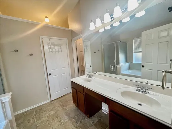 a bathroom with a sink vanity and a mirror
