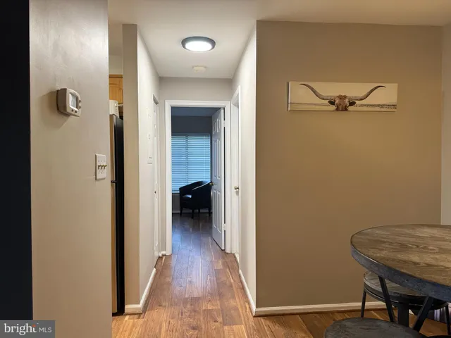 a view of a room with a wooden floor