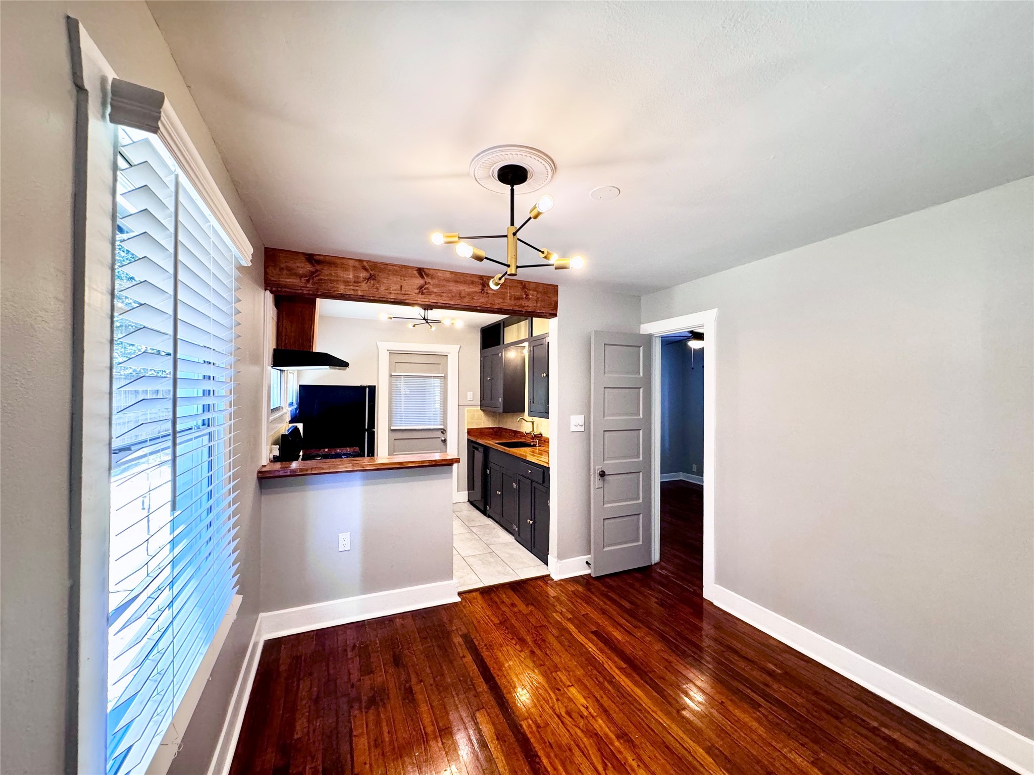 1018 Dunbar Street Houston, TX 77009 - Photo 11 of 30 Dining space is punctuated with a dramatic light fixture and open to the kitchen!