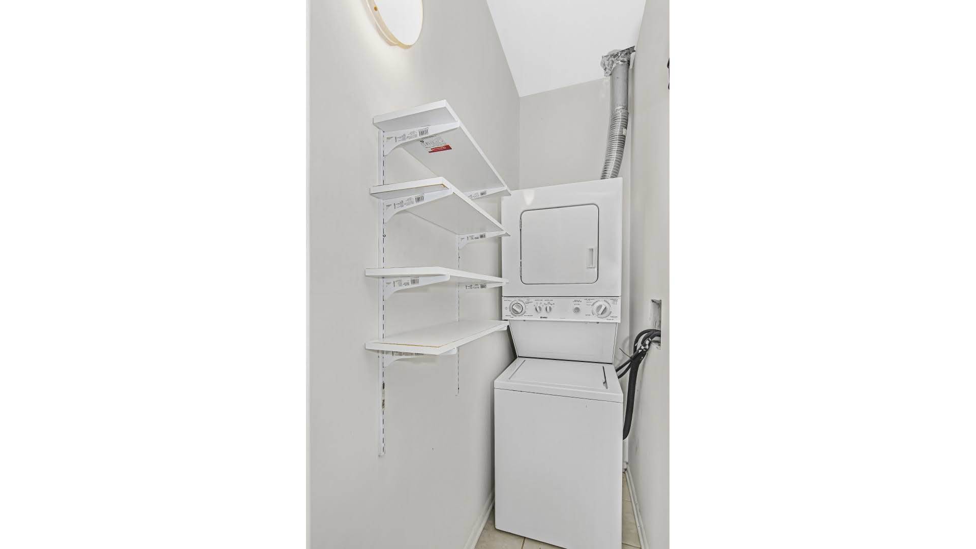 4055 South Calumet Avenue, Unit 3 Chicago, IL 60653 - Photo 15 of 15 a utility room with dryer and washer