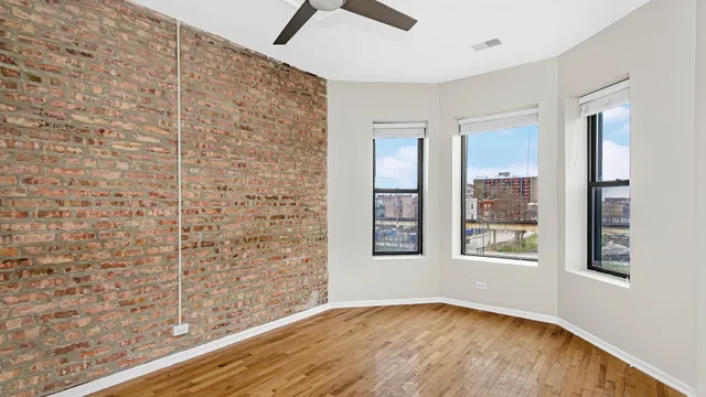 a view of an empty room with windows