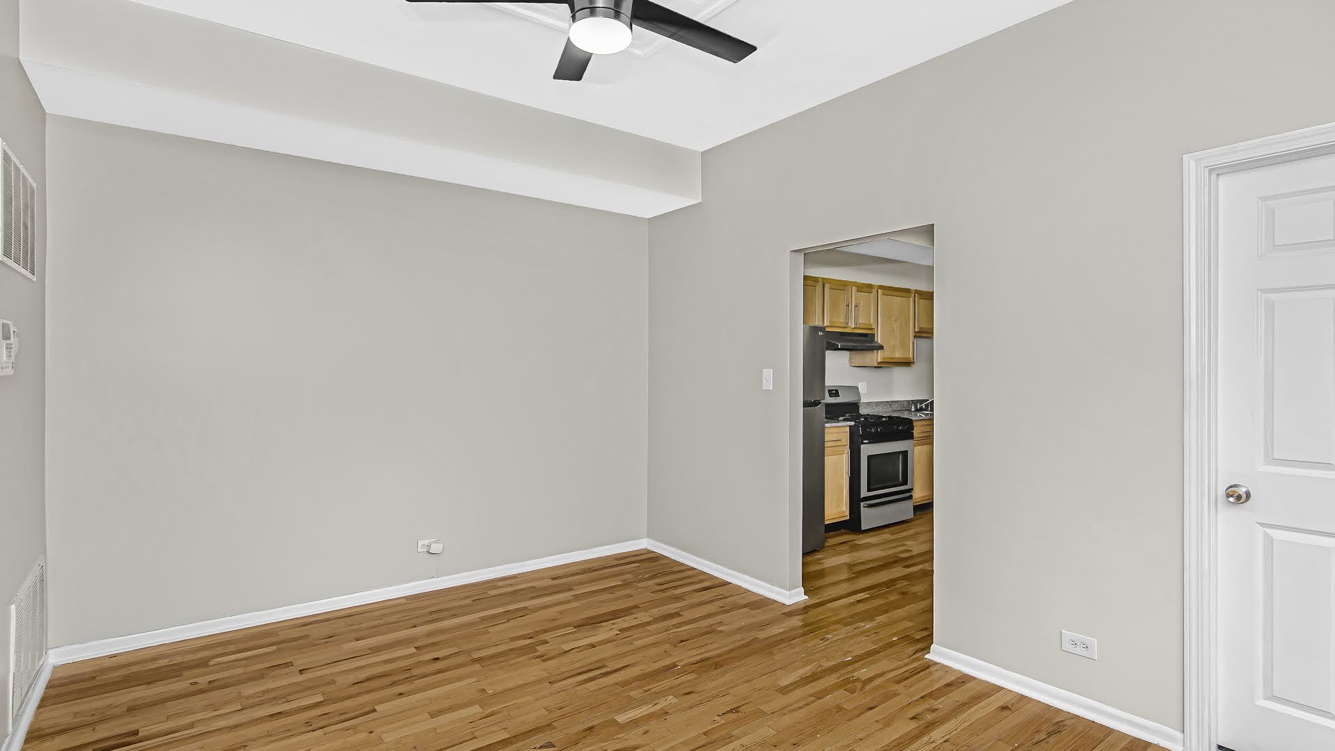 4055 South Calumet Avenue, Unit 3 Chicago, IL 60653 - Photo 5 of 15 a view of empty room with wooden floor