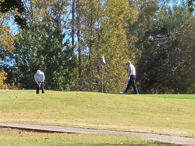 a view of swimming pool with a yard