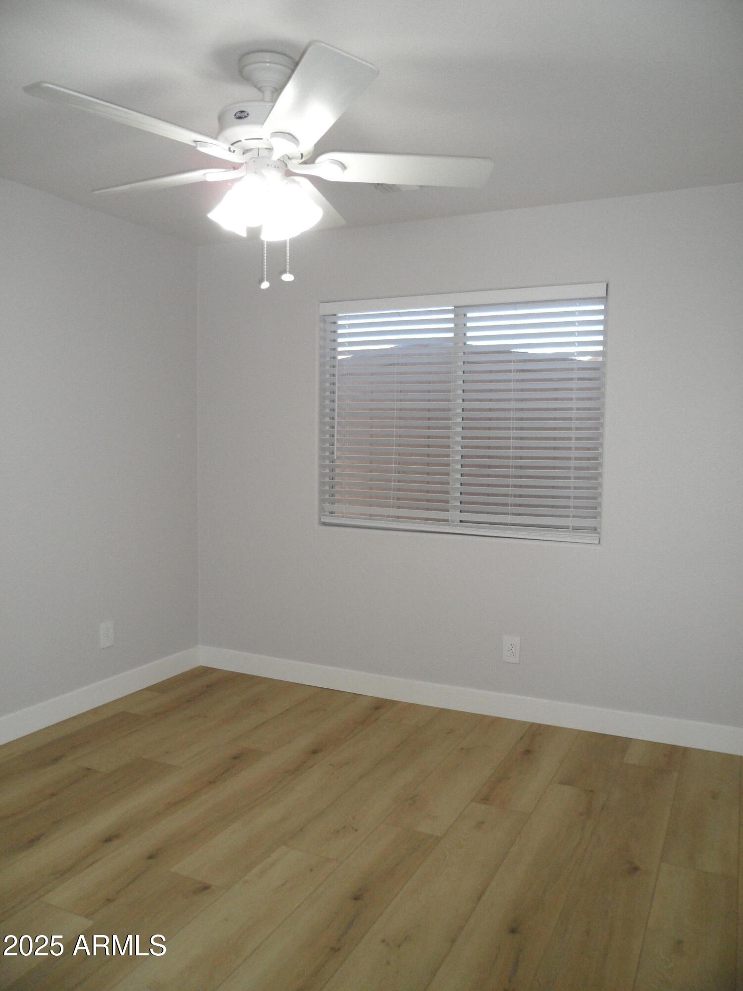 3812 South Seton Avenue Gilbert, AZ 85297 - Photo 12 of 18 a view of an empty room with a window