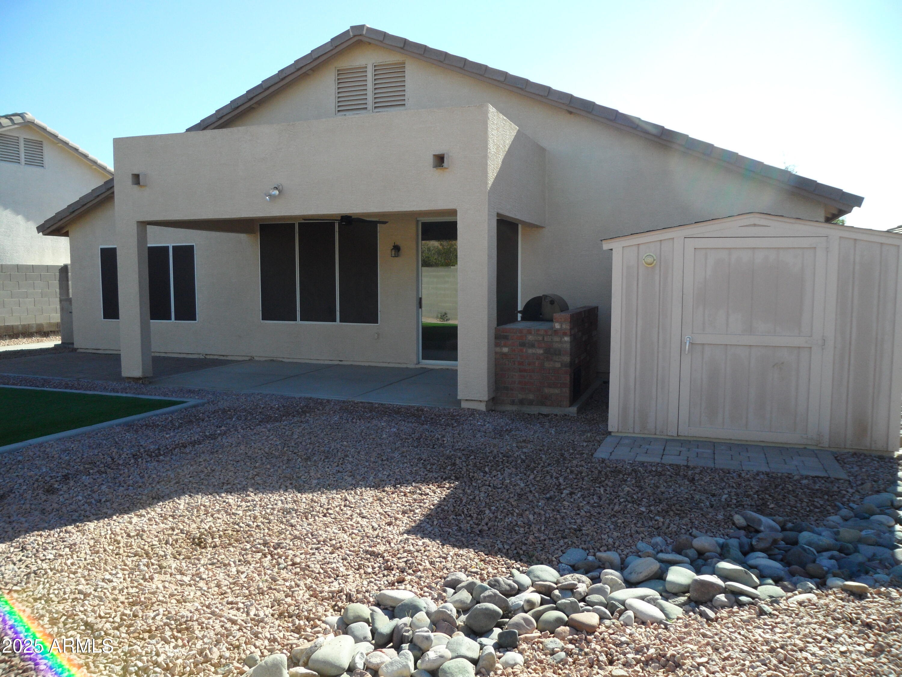 3812 South Seton Avenue Gilbert, AZ 85297 - Photo 17 of 18 a front view of a house with a yard