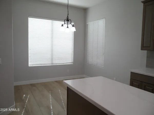 a large kitchen with kitchen island a sink stainless steel appliances and cabinets