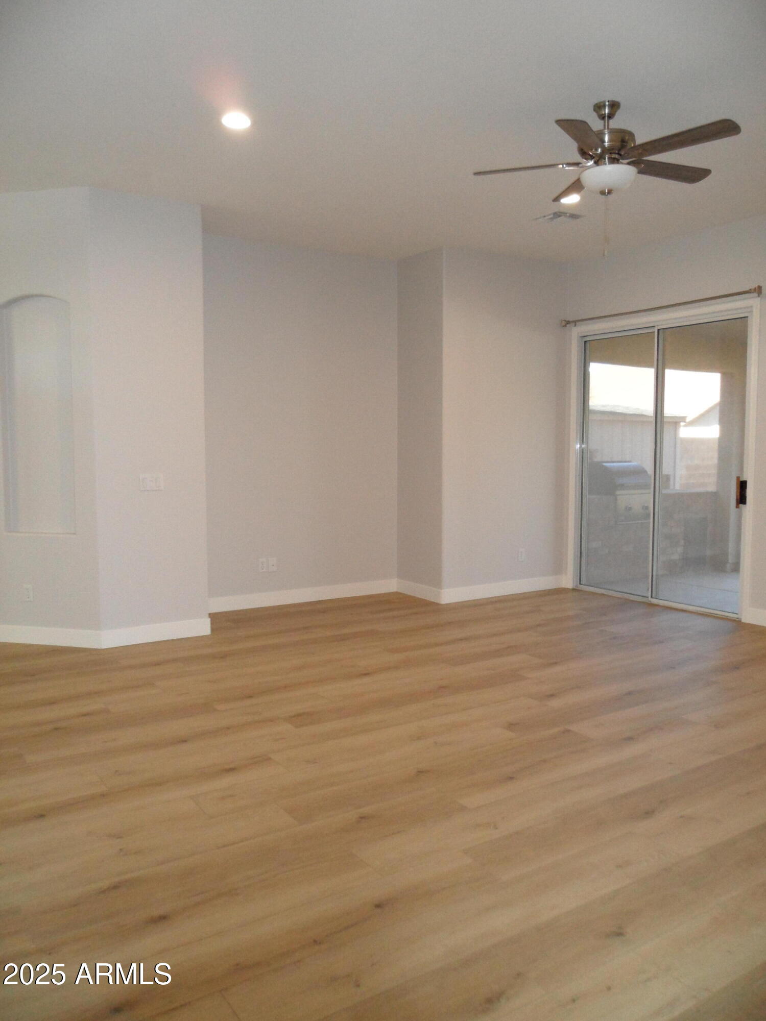 3812 South Seton Avenue Gilbert, AZ 85297 - Photo 6 of 18 a view of an empty room with a window