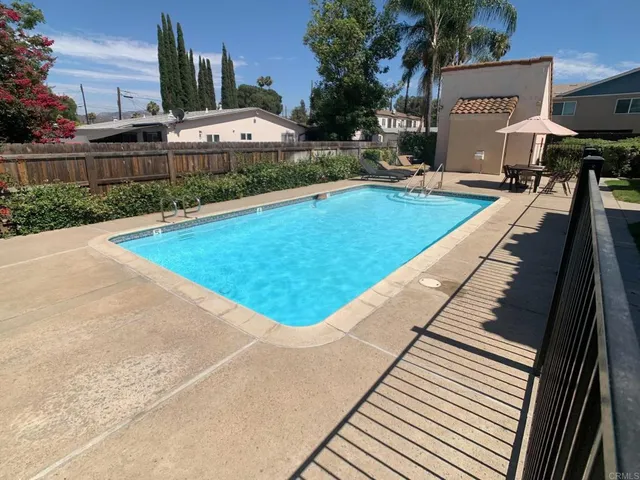 a view of a backyard with sitting area