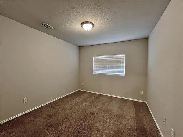an empty room with a workbench