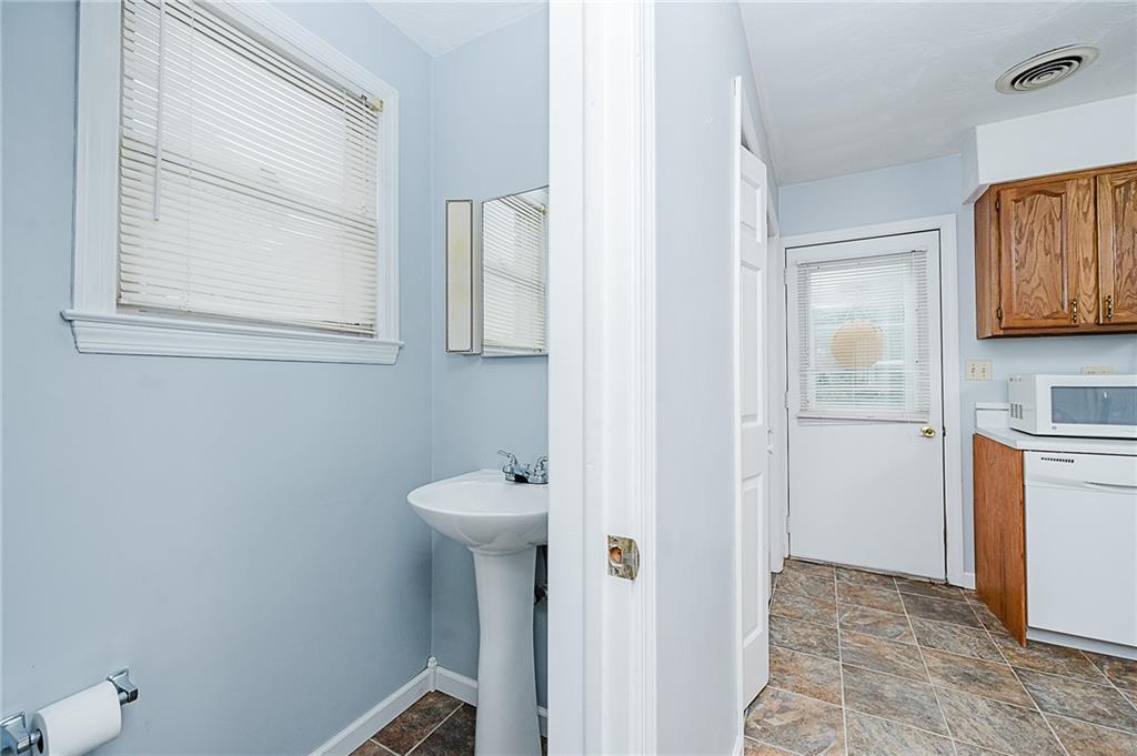 4852 Lucerne Road Indiana, PA 15701 - Photo 12 of 22 a bathroom with a toilet sink and mirror
