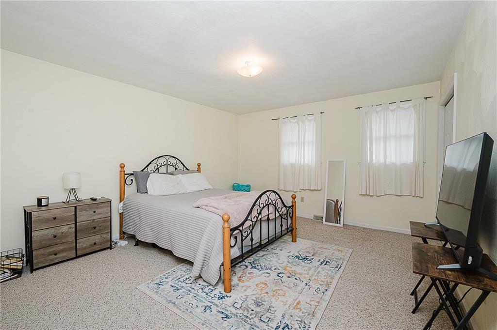 4852 Lucerne Road Indiana, PA 15701 - Photo 16 of 22 a bedroom with a bed a flat screen tv and a dresser