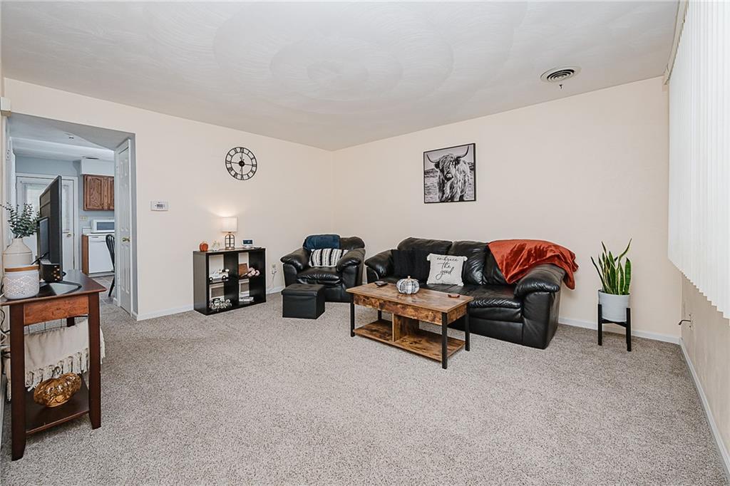 4852 Lucerne Road Indiana, PA 15701 - Photo 2 of 22 a living room with furniture and a lamp