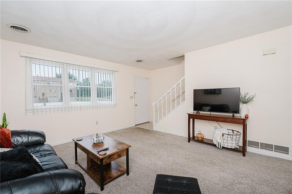 4852 Lucerne Road Indiana, PA 15701 - Photo 4 of 22 a living room with furniture and a flat screen tv
