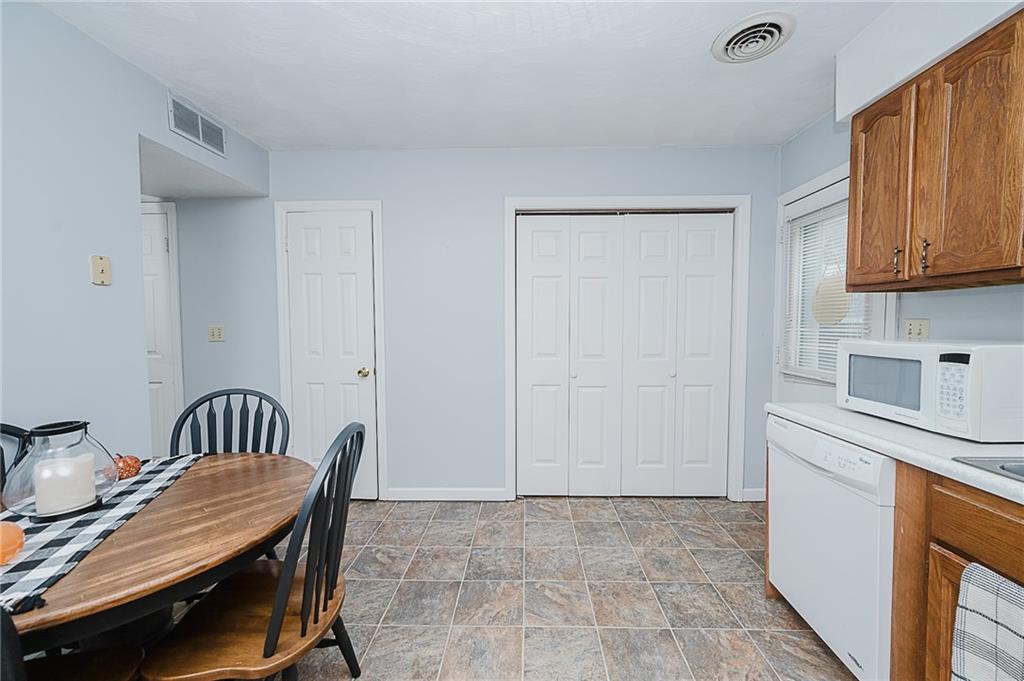 4852 Lucerne Road Indiana, PA 15701 - Photo 9 of 22 a view of a kitchen with a sink cabinets and wooden floor