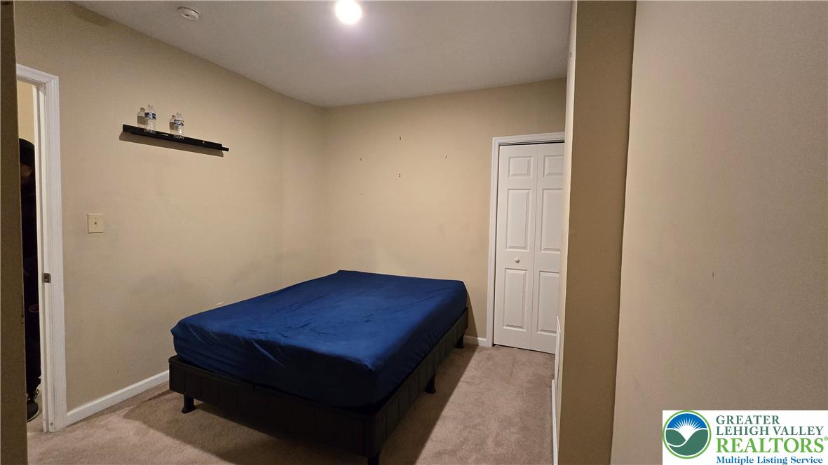 1116 West Maple Street Allentown, PA 18102 - Photo 20 of 38 a room with a bed and a table
