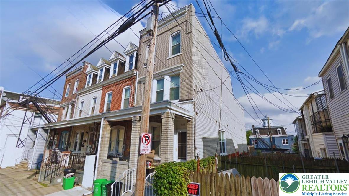 1116 West Maple Street Allentown, PA 18102 - Photo 3 of 38 a view of a brick building with many windows