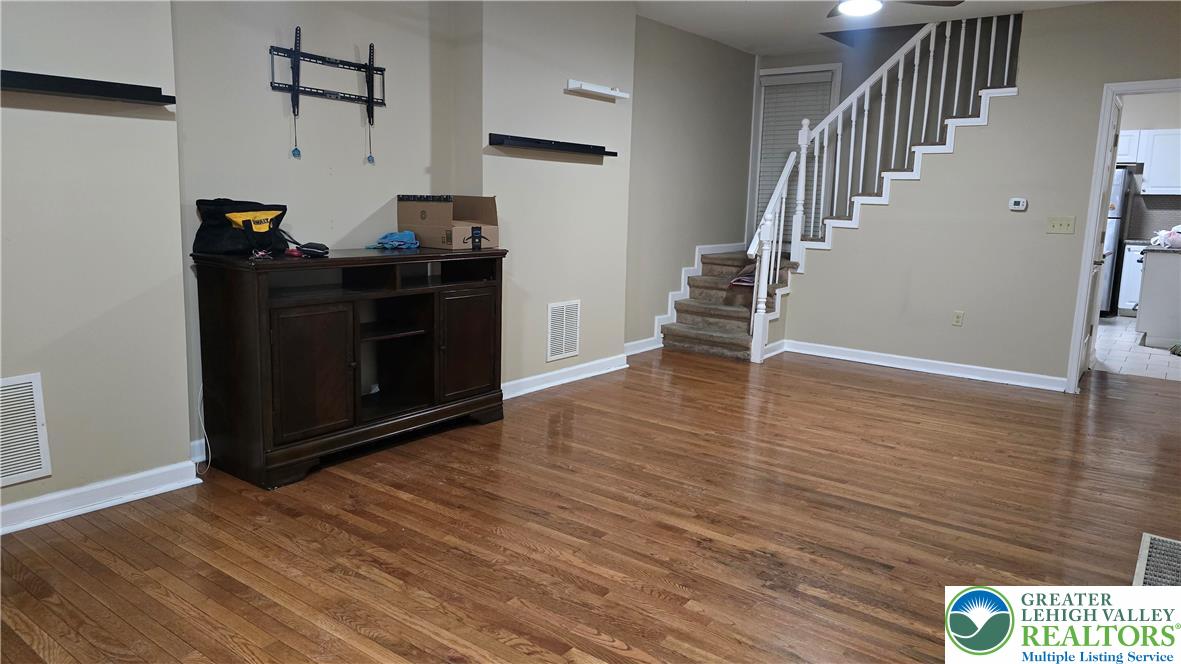 1116 West Maple Street Allentown, PA 18102 - Photo 6 of 38 a view of a hallway with wooden floor