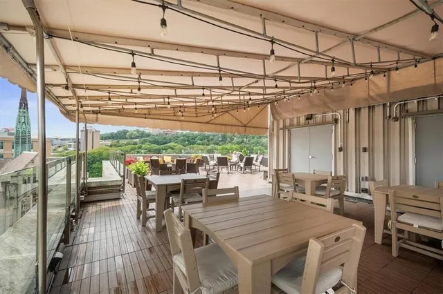 a view of a patio with table and chairs